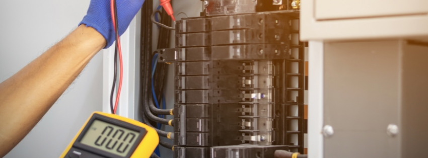 Professional handyman completing electrical repair